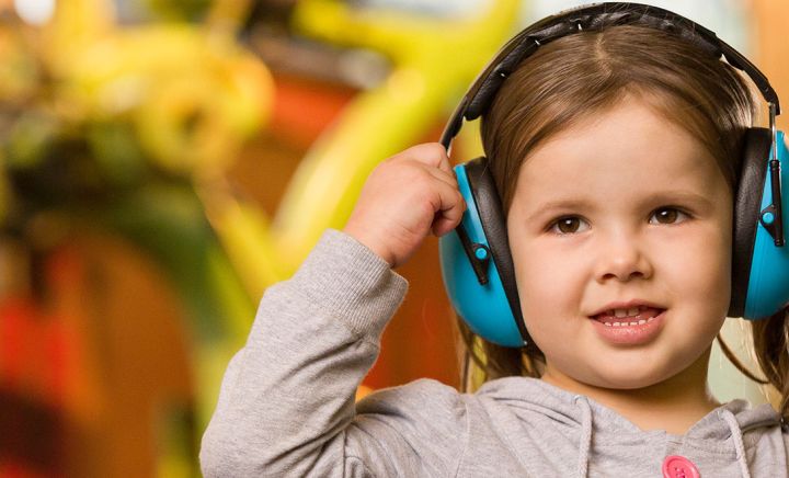 Banner accessibility girl with noise cancelling headphones
