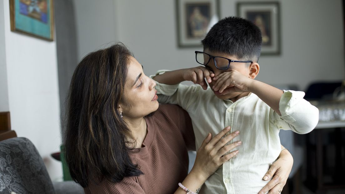 Boy meltdown with mom comforting web small