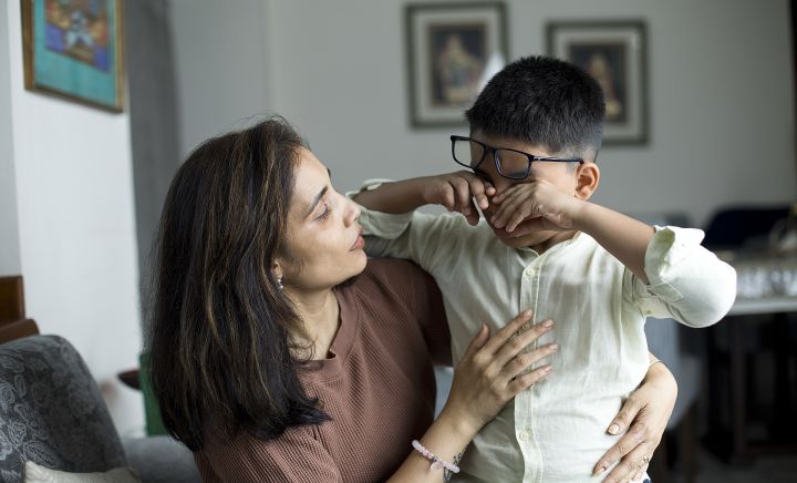 Boy meltdown with mom comforting web small