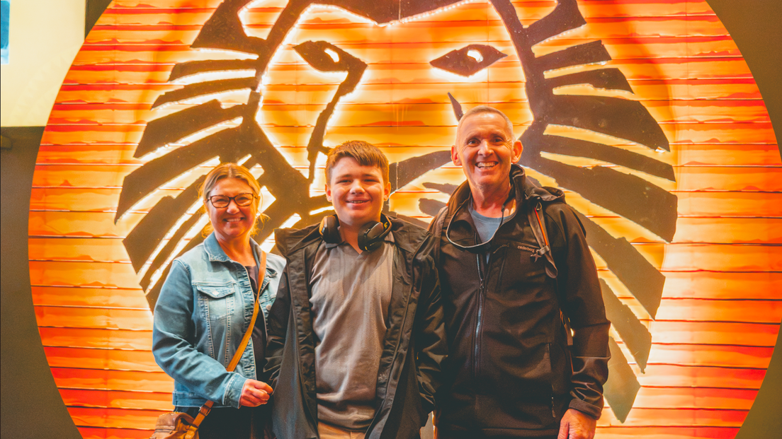 Fynn and his parents at the Lion King musical for Connection Day.