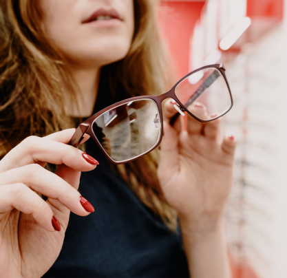 Woman trying on reading glasses
