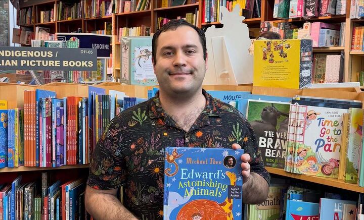 Michael Theo with his debut book 'Edward’s Astonishing Animals' - photos credits @kinokuniya_sydney (Instagram)