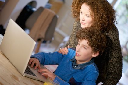 Mother and son undertaking Distance Education