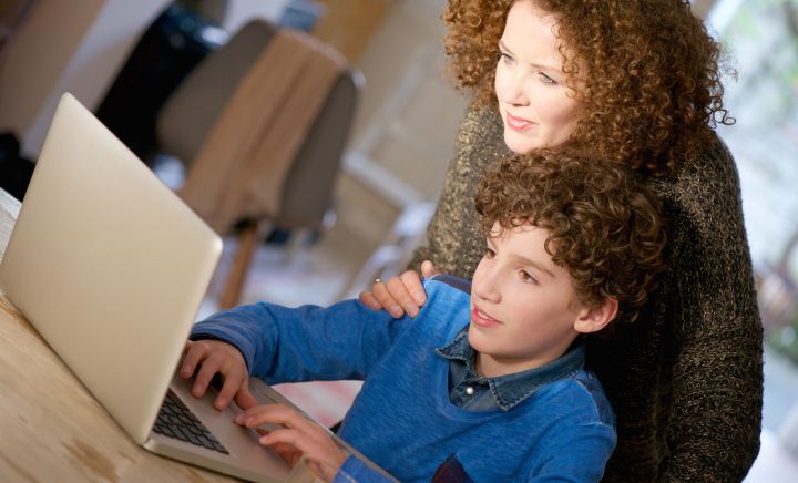 Mother and son undertaking Distance Education