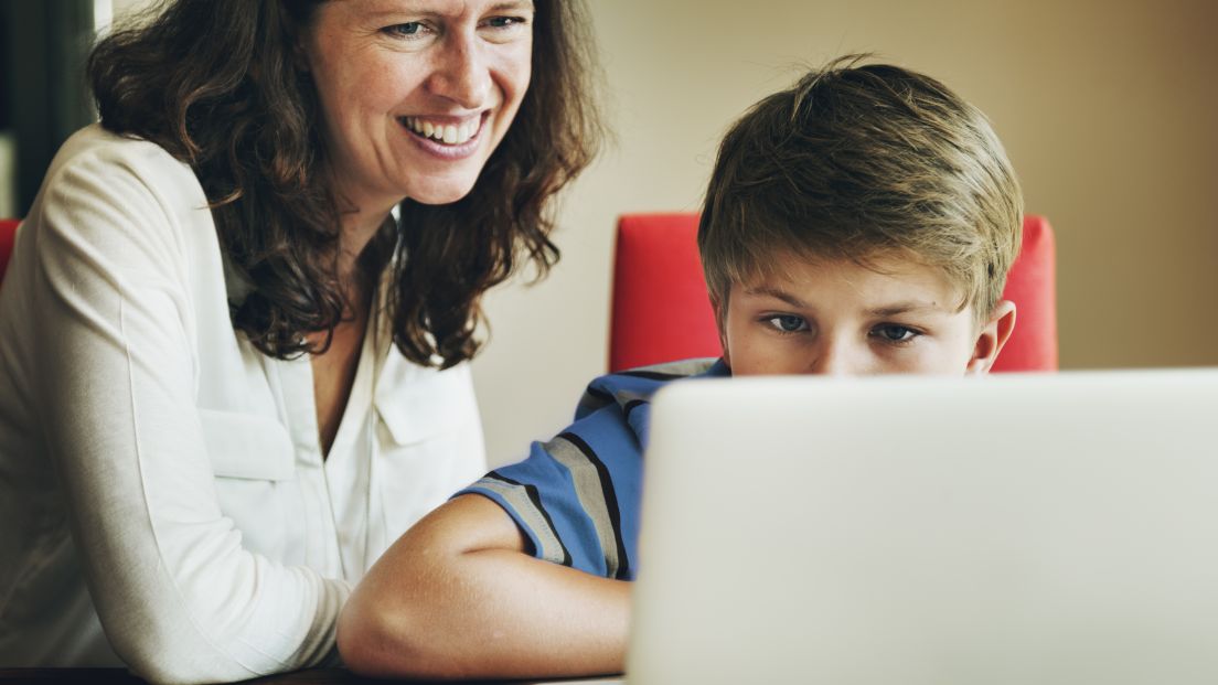 Mother and Son undertaking Distance Education