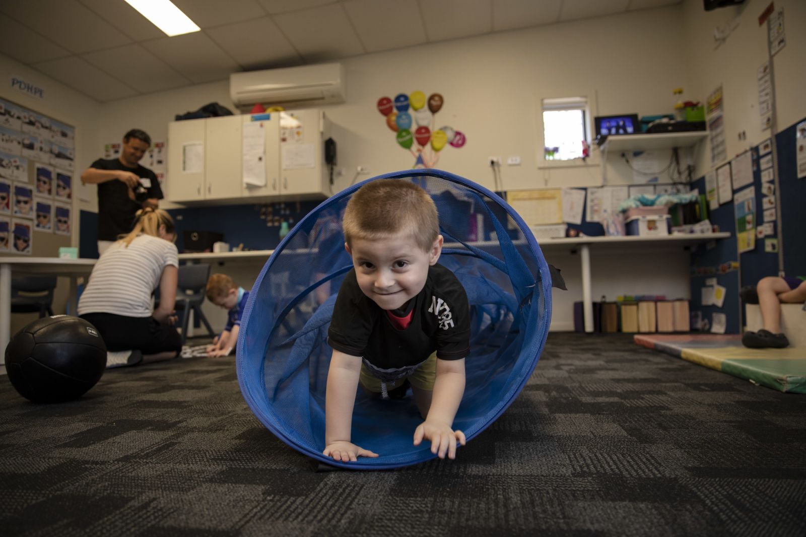 A student crawls through the tunnel during play time!