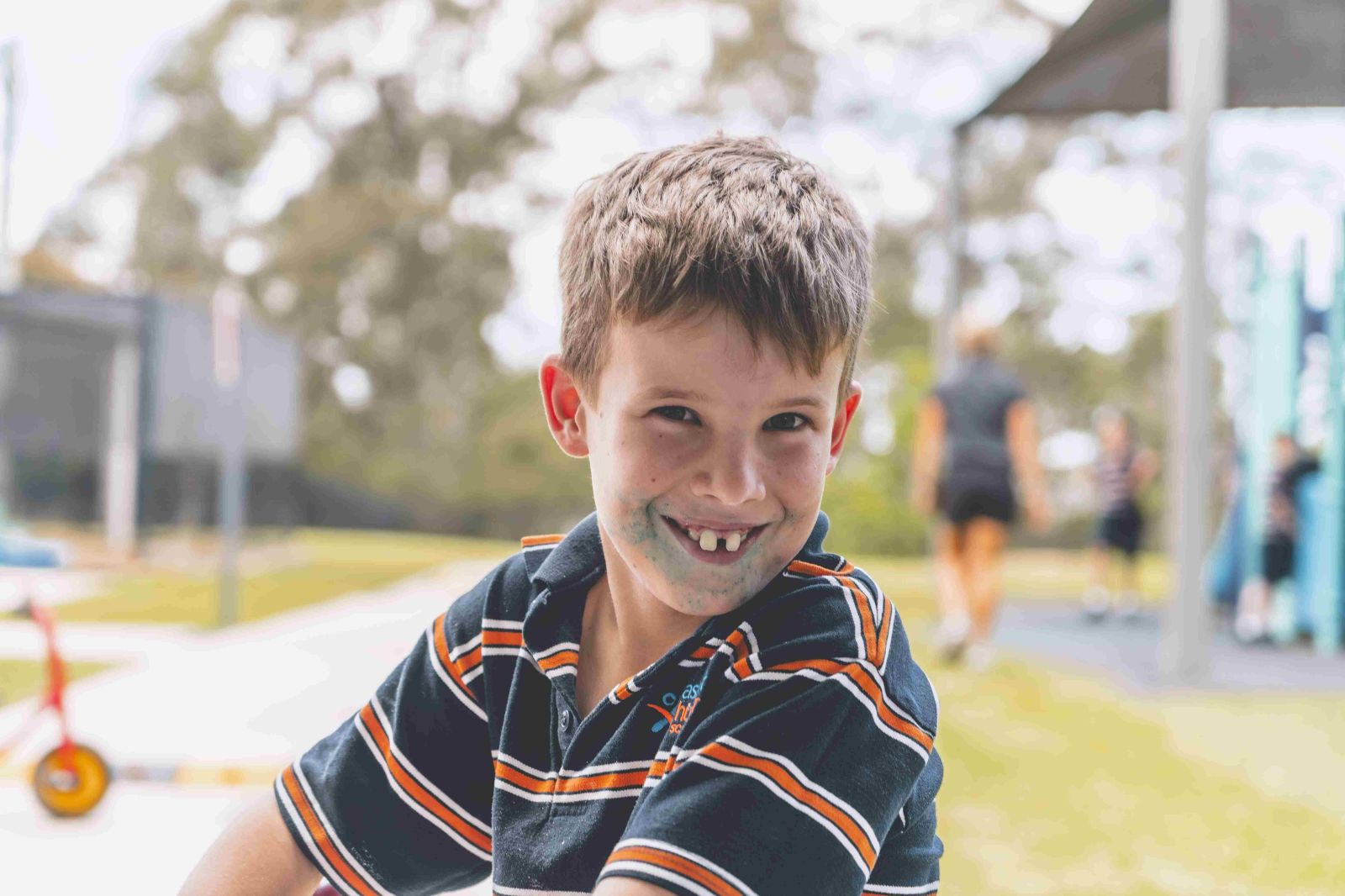 Student smiling during outdoor playtime