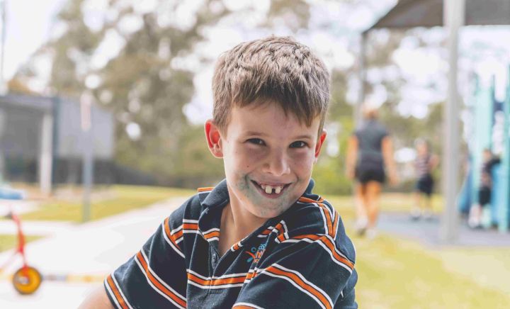 Student smiling during outdoor playtime