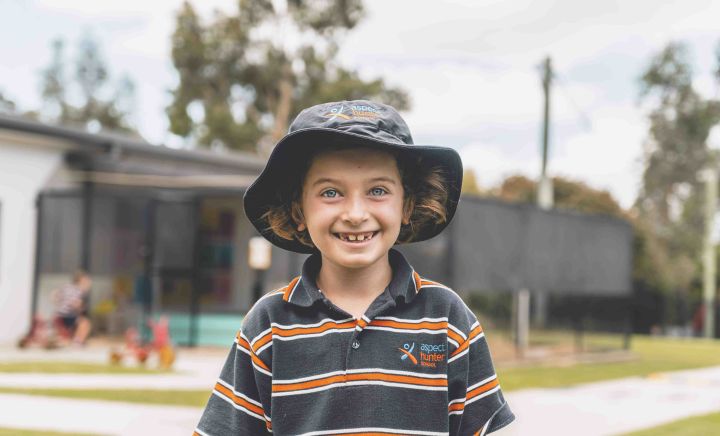 Student in school uniform enjoying playground space