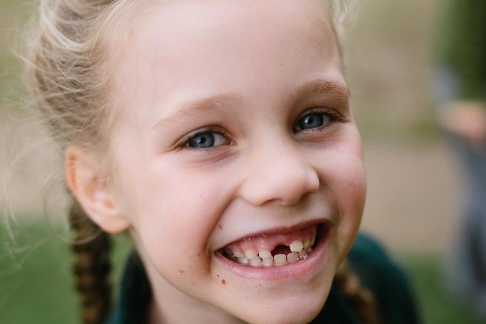 A student smiles for her portrait at Macarthur School