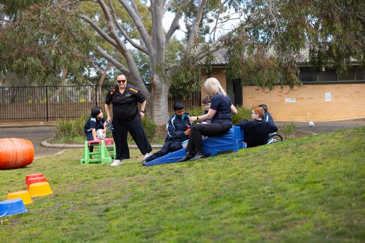Wagga Wagga students using the play equipment on the grass
