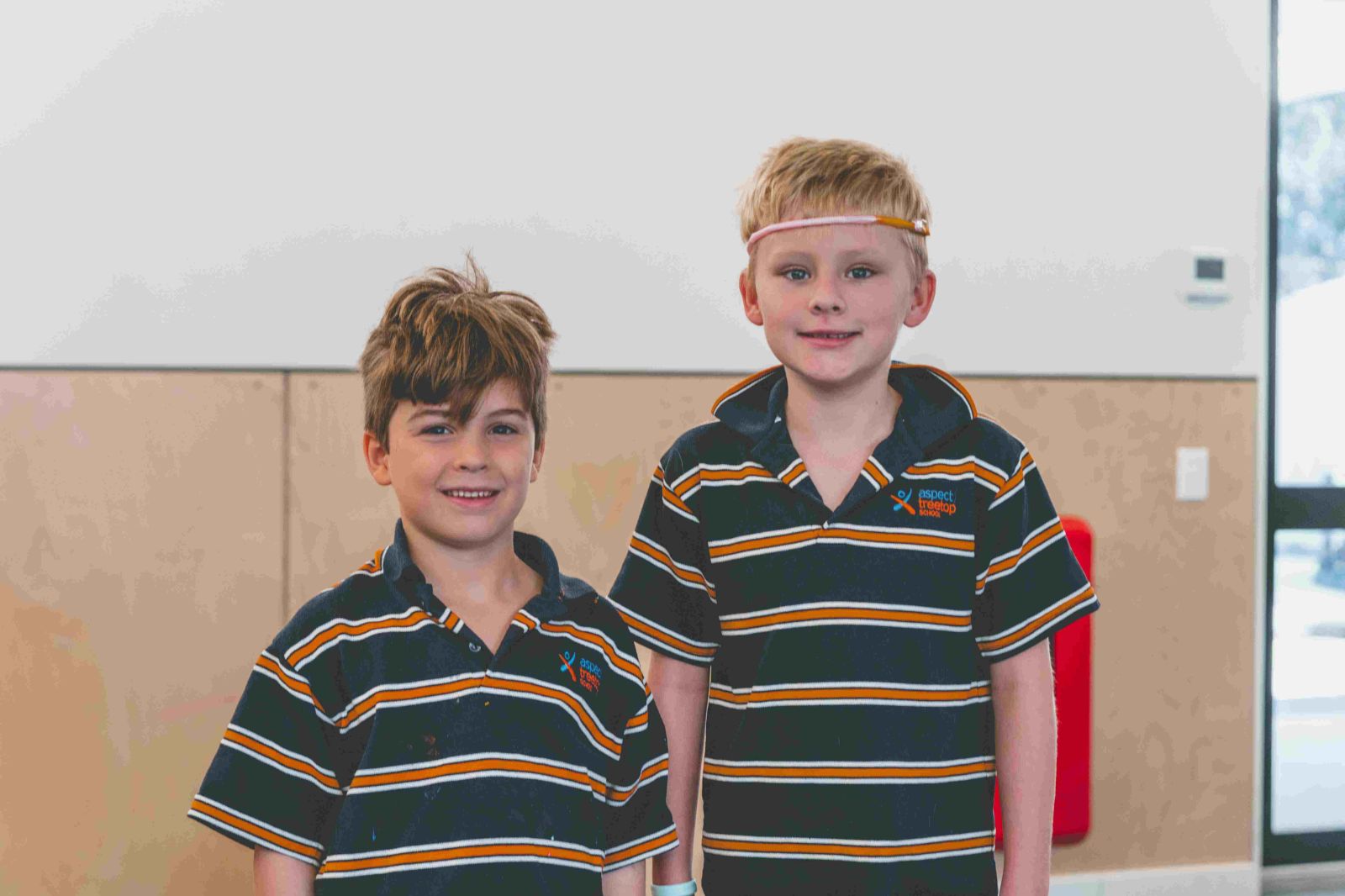 Two students smiling