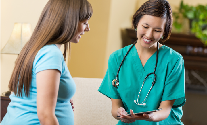 Pregnant woman and doctor