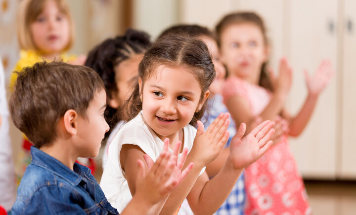 Preschool children dancing clapping happy small